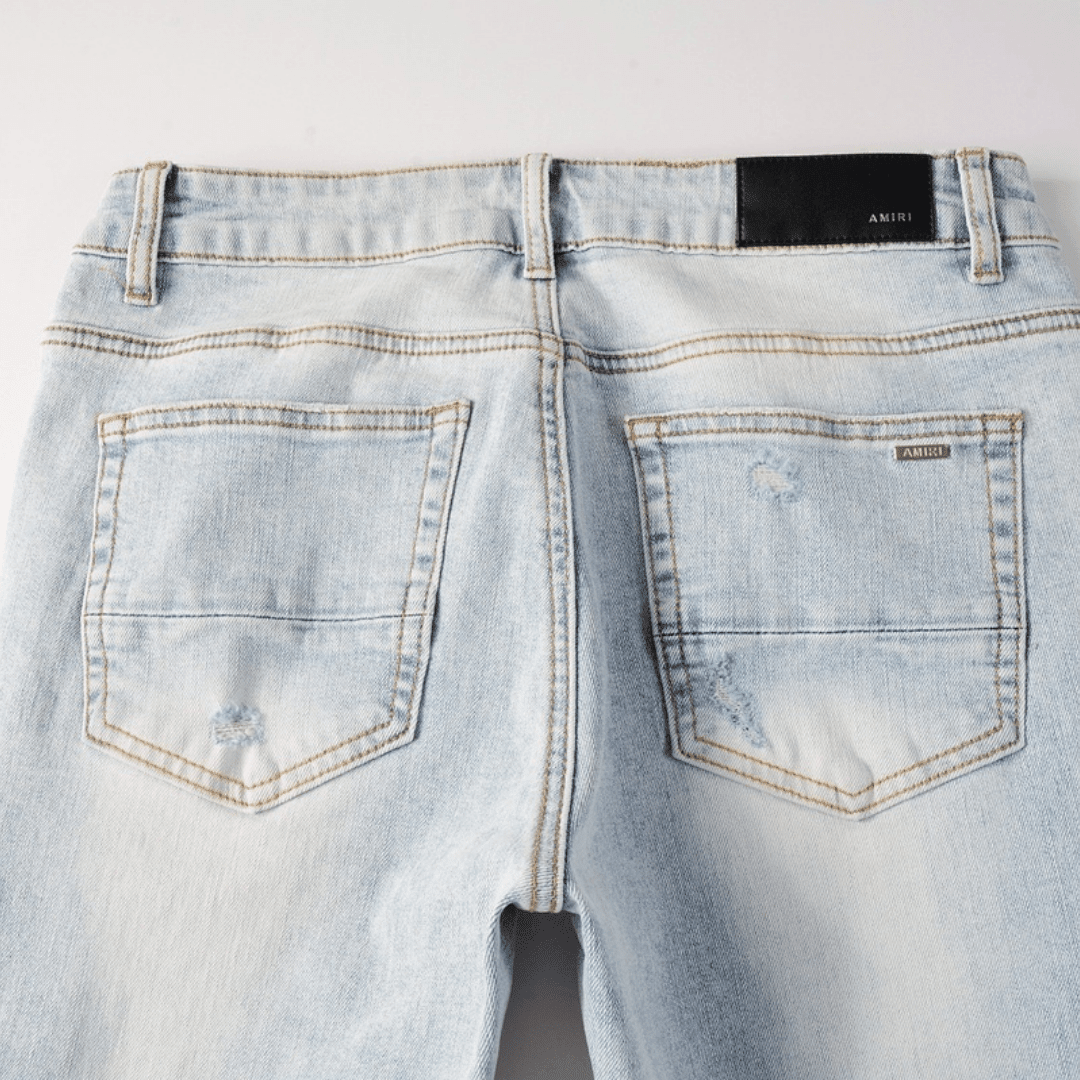 Amr Blue Patch Distressed Jeans - Novell "Fashion"