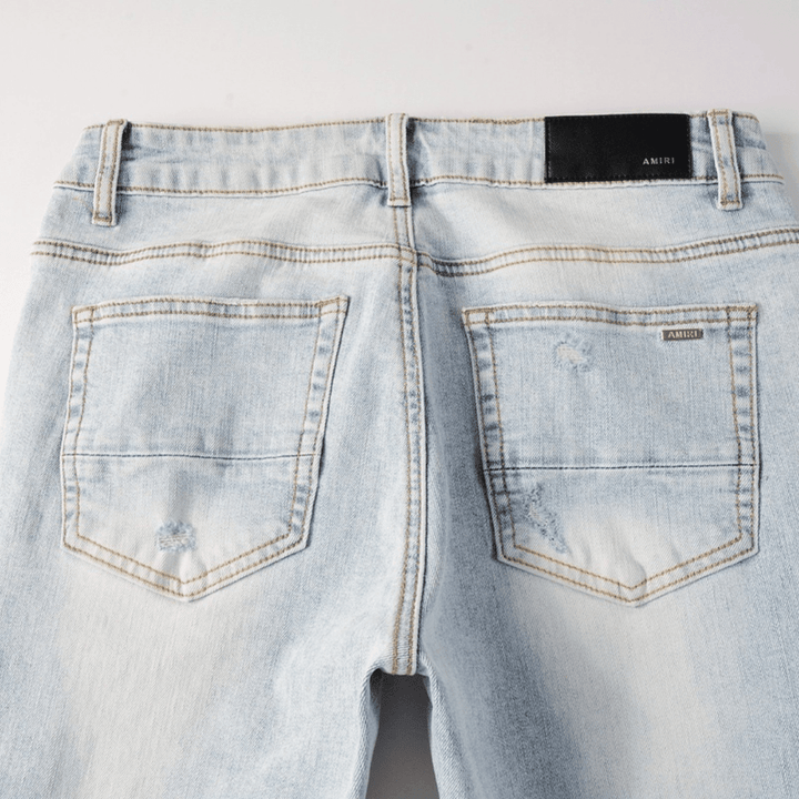 Amr Blue Patch Distressed Jeans - Novell "Fashion"