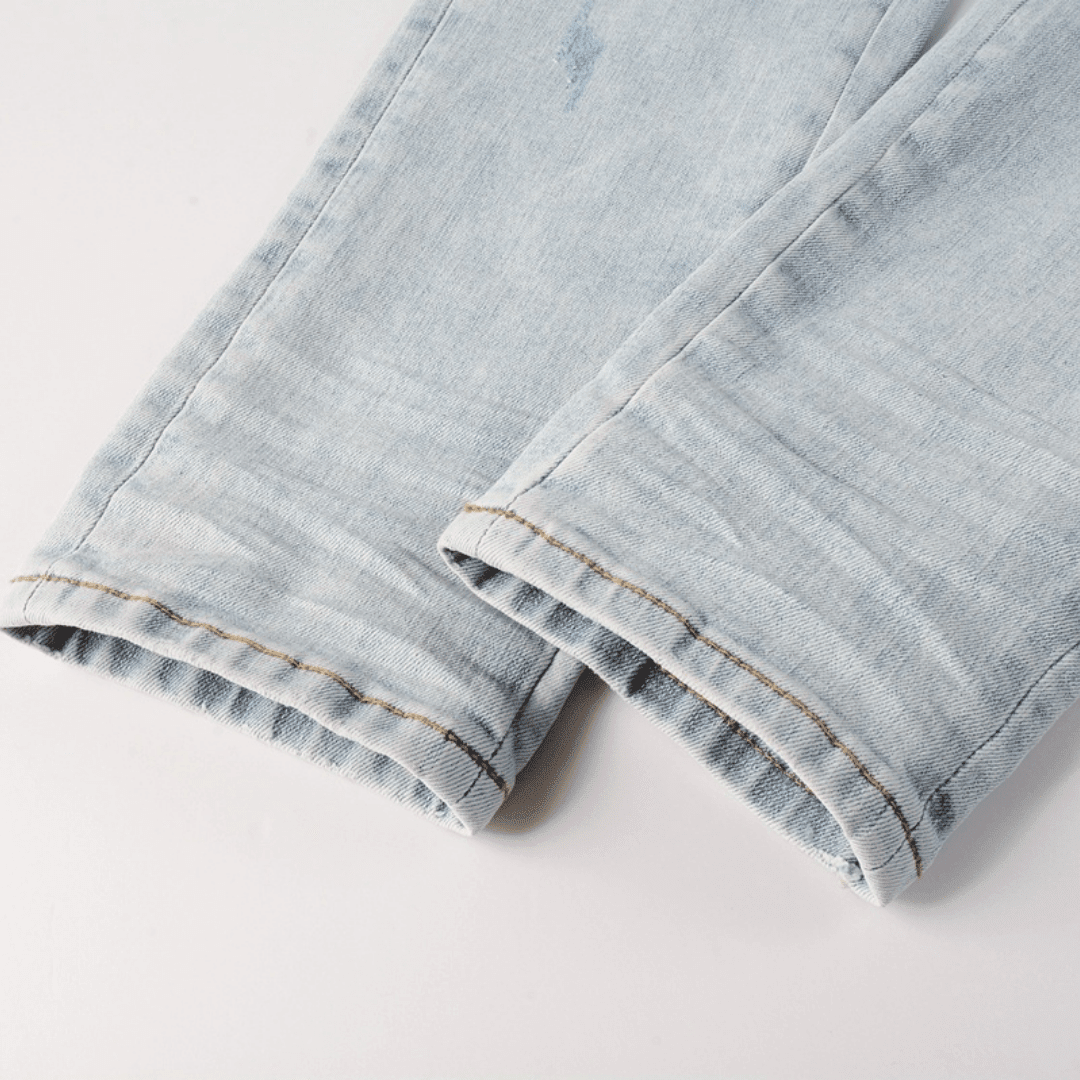 Amr Blue Patch Distressed Jeans - Novell "Fashion"