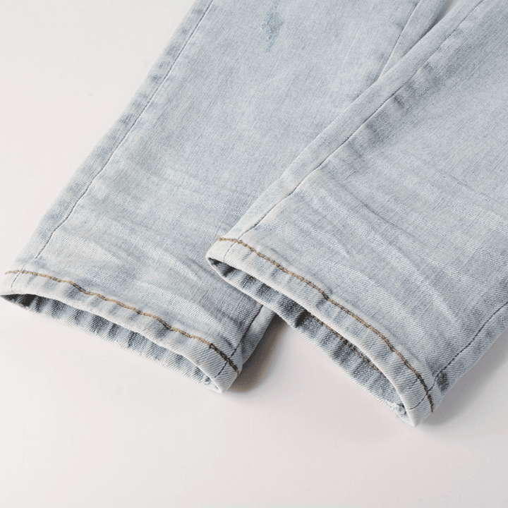 Amr Blue Patch Distressed Jeans - Novell "Fashion"